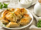 Cooking Class - Traditional Dumplings From Around the World in Northern Suburbs: pierogi dumplings with sour cream on the side
