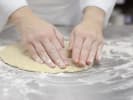 Cooking Class - The Art of Making Pizza in Downtown Dallas: chef crafting pizza dough