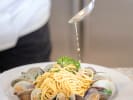 Cooking Class - Coastal Italian Favorites: plating pasta with clams