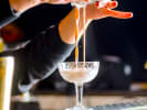 Online Mixology Class - Winter Wonderland Cocktails: pouring a christmas cocktail