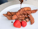 Cooking Class - Mexican Street Food 101: pouring chocolate sauce on churros