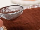 Cooking Class - Baking Classics in Downtown Sacramento: pouring cocoa powder on tiramisu