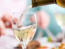 Virtual Wine Tasting - Comfort and Joy Holiday Wine: pouring white wine into a wine glass