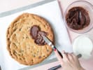 Online Cooking Class - S'mores Cookie Pizza: putting chocolate ganache on cookie pizza