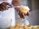 Couples Cooking Class - Spooky Cupcake Decorating Workshop in Brooklyn: putting frosting on cupcakes