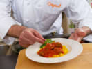 Online Cooking Class - A Classic Meatball Pasta Meal: putting tomato sauce on pizza