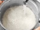 Cooking Class - Authentic Greek Feast in Vancouver: rinsing rice in water