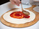 Cooking Class - A Pizza Party in San Jose: saucing pizza