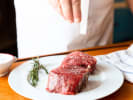 Cooking Class - Steakhouse-Inspired Surf and Turf: seasoning steak