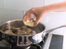 Online Cooking Class - Cape Cod Classics: Clam Chowder & Portuguese Mussels: simmering clams and pouring broth to the pot