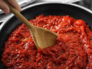 Cooking Class - Traditional Pasta-Making in Downtown Chicago: simmering fresh tomato sauce in a pan