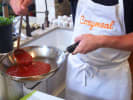 Cooking Class - Make Gnocchi at a Global Restaurant in Minneapolis: simmering tomato sauce in a pan