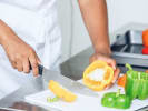 Team Building Cooking Class - Mystery Box Cooking Competition in Nashville: slicing fresh bell peppers