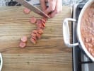 Cooking Class - Gumbo Dinner Party in New Orleans: slicing sausage