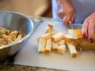 Online Cooking Class - Trendy Tastes of the '90s: slicing sourdough bread to make croutons