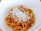 Team Building - Celebratory Italian Feast in Austin: spaghetti pasta with bolognese