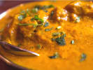 Cooking Class - Plant-Based Garden Feast: spoon scooping up tikka masala