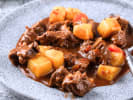 Cooking Class - Hearty Soups and Stews: spooning hearty beef stew from a dish