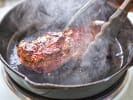Cooking Class - Flavors From a French Bistro in Manhattan: steak cooking in a cast iron skillet