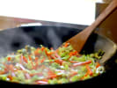 Cooking Class - Mastering Asian Chinese: stir frying vegetables in a wok