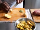 Cooking Class - Traditional French Delights in Manhattan: student cutting potatoes