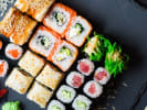Team Building Cooking Class - Spectacular Sushi Showdown in Nashville: sushi rolls and nigiri on a black slate tray