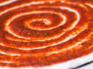 Team Building Cooking Class - Pizza-Making With Your Team in Toronto: tomato sauce on pizza dough