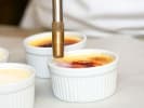 Team Building Cooking Class - Cook & Connect in Northern Virginia: torching creme brulee dessert