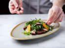 Cooking Class - Tuscan Awakening: tossing a seasonal salad in a bowl