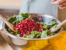 Cooking Class - The Decadent Delights of a Persian Meal in Toronto: tossing pomegranate seeds with herbs