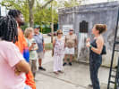 Food Tour - Garden District Food and Cemetery Tour in New Orleans: tour guide and tourists sightseeing