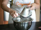 Cooking Class - Scratch-Make English Muffins in Toronto: whisking batter by cracking up an egg