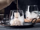 Online Mixology Class - Scary Good Horror Film-Inspired Cocktails: white chocolate liqueur being poured
