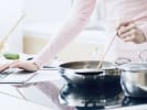 Online Cooking Class - Chettinad Chicken Curry and Lemon Rice: woman cooking while looking at a computer