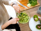 Team Building Cooking Class - Guacamole Mashup Competition: woman making guacamole at a team building event