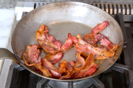 https://res.cloudinary.com/hz3gmuqw6/image/upload/c_fill,h_300,q_auto,w_450,f_auto,q_auto/f_auto/frying-bacon-in-a-pan-930164D