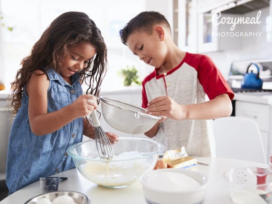 pastry chef girl, baker holds whisk in her hands, cooked cake on