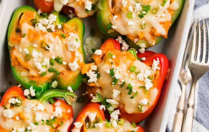 buffalo chicken stuffed peppers are a cheesy, spicy keto lunch idea