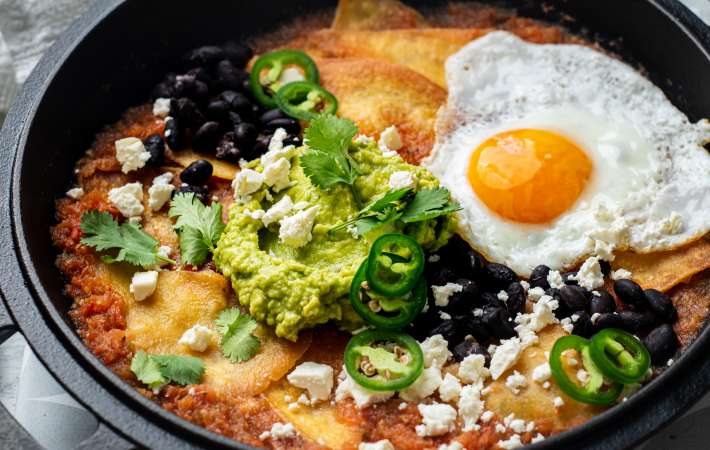chilaquiles rojos is a mexican side dish that can be enjoyed at any time of the day