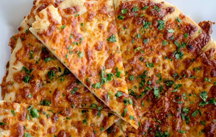 overhead shot of new york style pizza pie