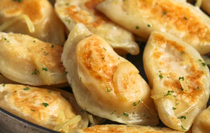 homemade perogi is a comforting and cheesy potato side dish