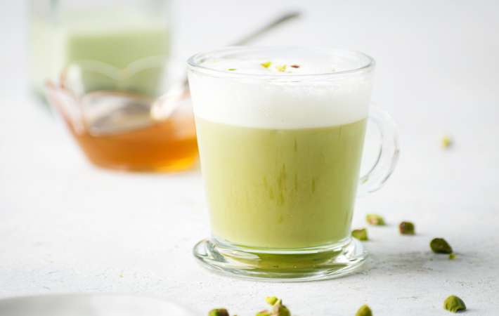 pistachio latte is a smooth and nutty vegan latte