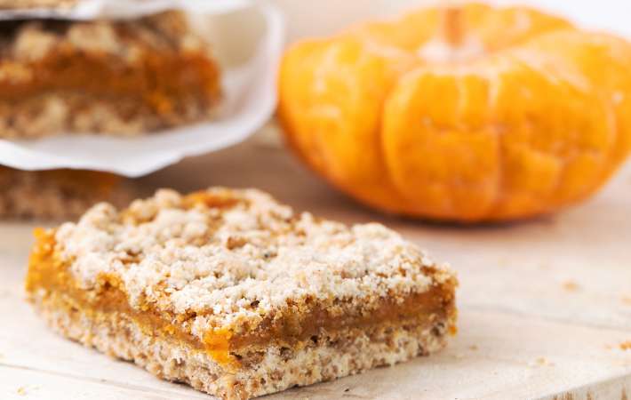 pumpkin pie bars are filled with fragrant spices for a vegan thanksgiving dessert