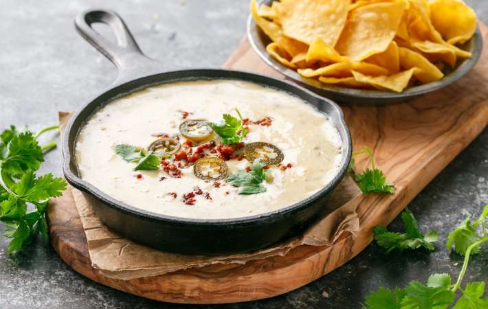 spicy chorizo queso dip is an indulgent white queso