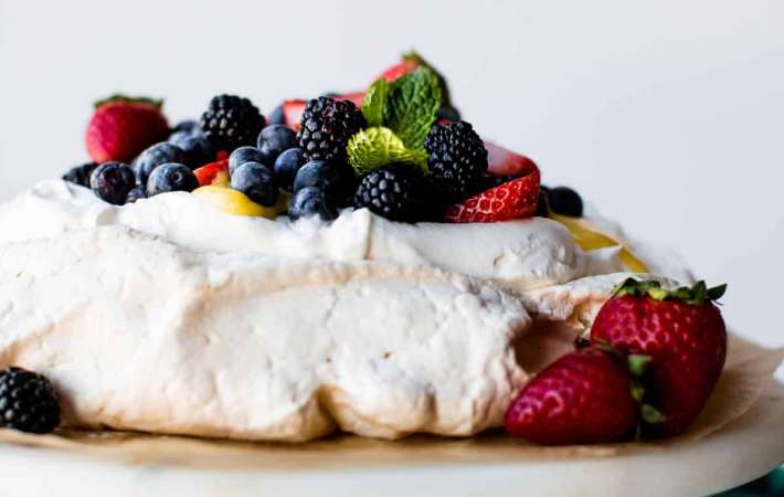 this fruity pavlova is a light and airy gluten free summer dessert