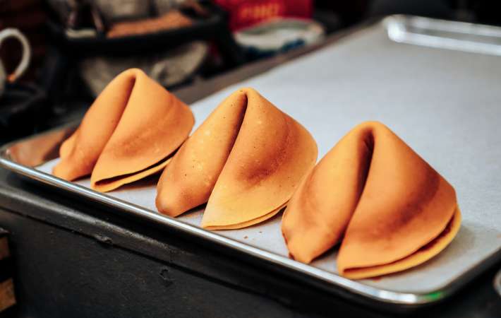 freshly made fortune cookies at the fortune cookie factory in san francisco