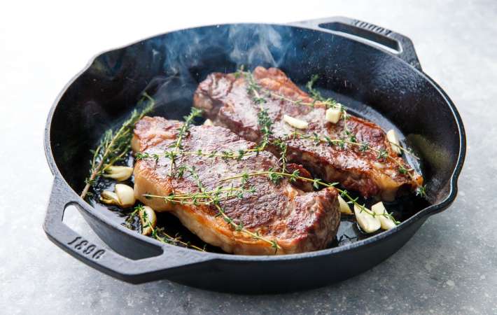 reverse sear steak with garlic and thyme achieves tender, juicy steaks