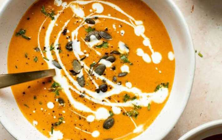 roasted carrot and ginger soup is a nutritious and warming vegetarian soup recipe