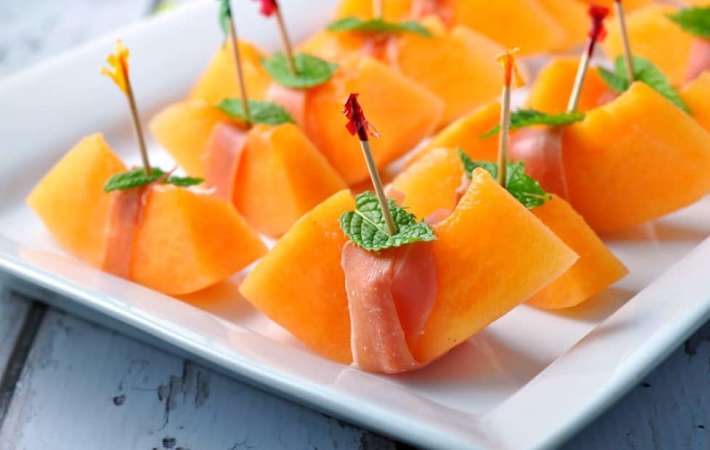 prosciutto with melon and mint is a sweet and savory easy healthy appetizer