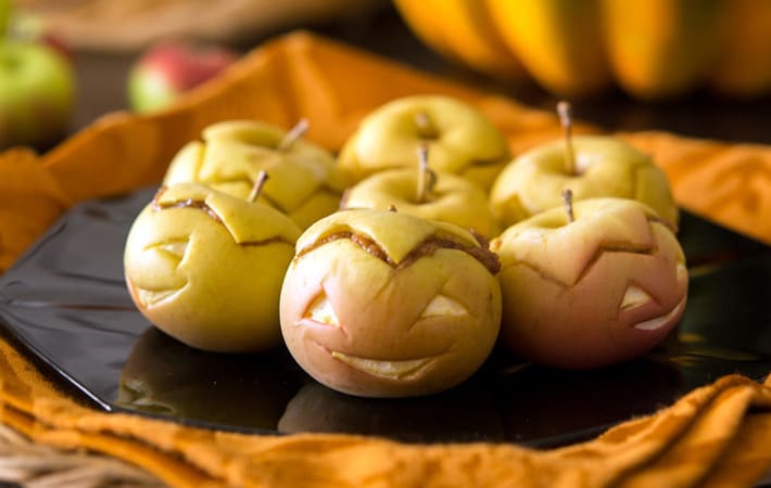 peanut butter apple lanterns are healthy halloween desserts that will light up the party